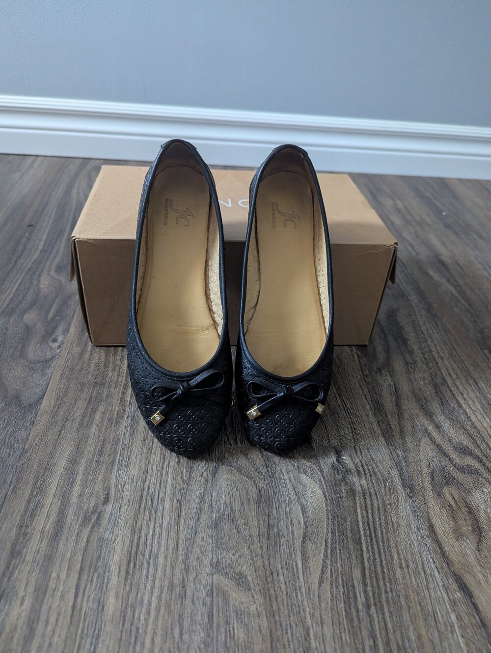 Laser cut leather ballet flats with bow detail